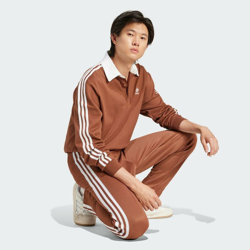 完売　アディカラーラグビーポロシャツ adidas ブラウン 長袖ポロシャツ アディカラーラグビーポロシャツ プリラブドブラウン ｜すべての商品